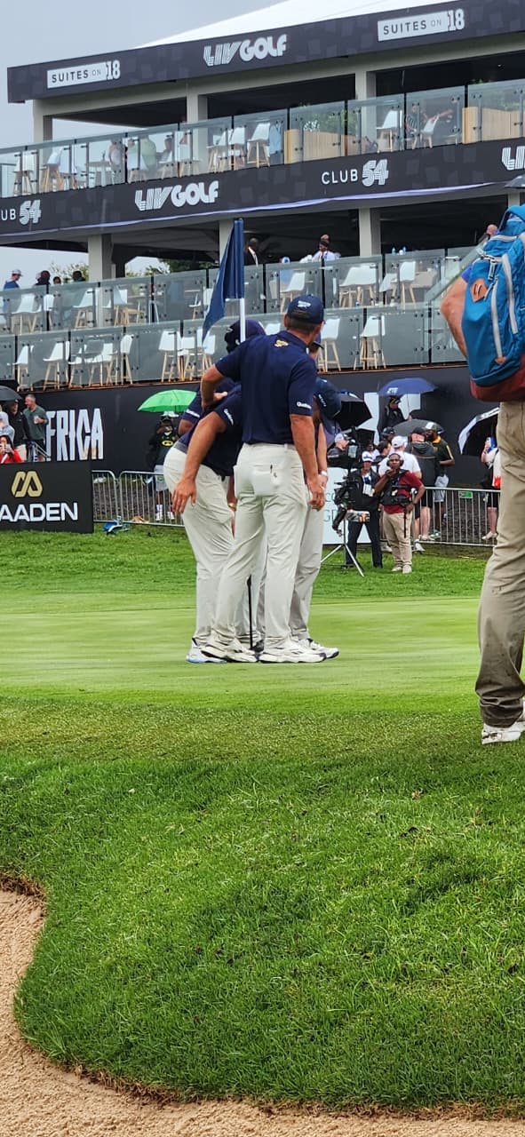 Players celebrating on the 18th green at LIV Golf South Africa