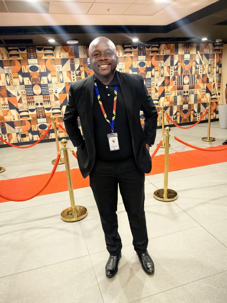 Kuda Kennedy Machiwana, Marketing Director South Africa for Golf Africa Safaris, on the red carpet at AGTC 2026